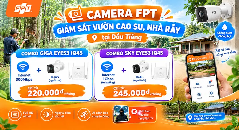 Camera IQ4S FPT gắn trên cột ở đầu lô cao su, điện thoại hiển thị thông báo phát hiện chuyển động, có logo FPT Telecom